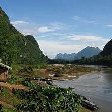 Muang Ngoi in a karst landscape covered by a deep jungle