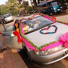 A decorated car, during a wedding ceremony