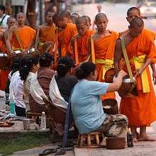 Morning Alms in Luang Prabang streets during sunrise